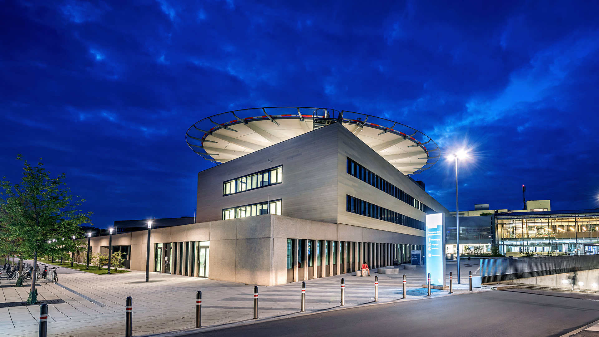The hospital's helipad building at dusk